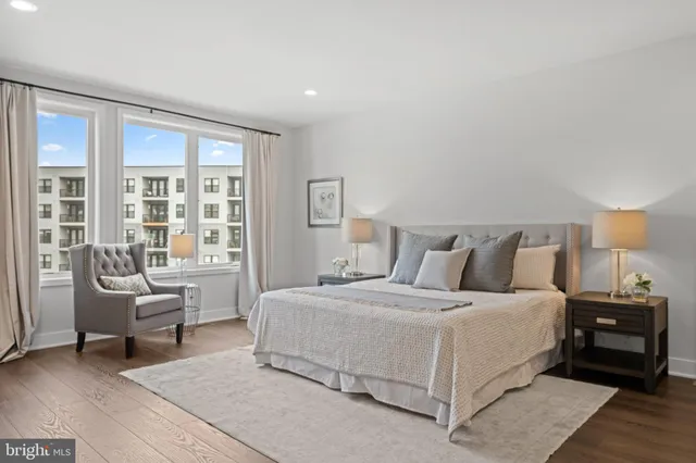 a bedroom with a bed and a couch