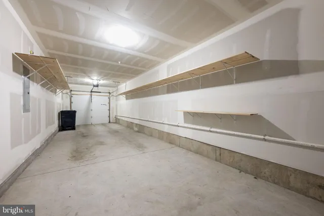 a view of a hallway with stairs