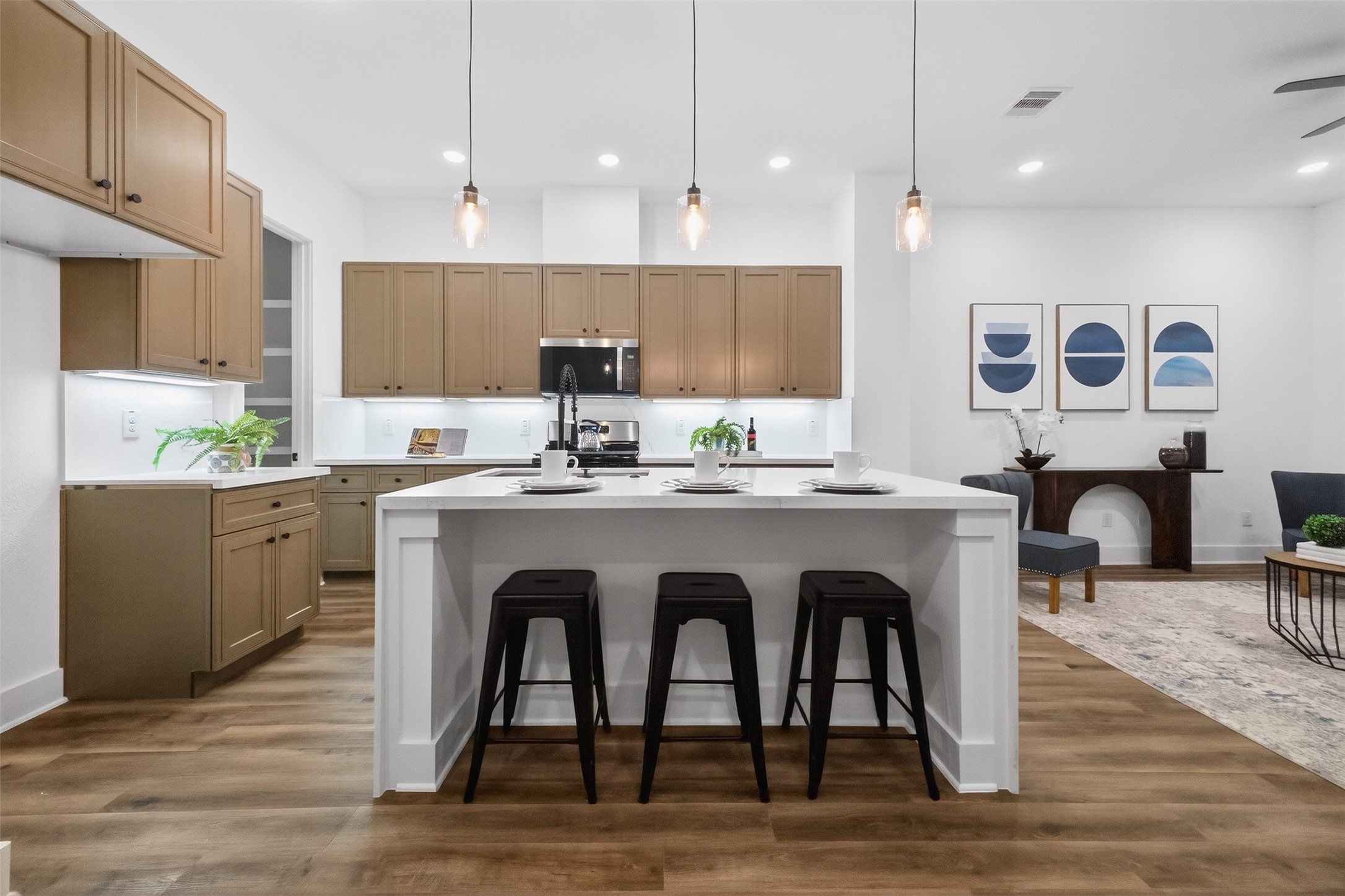 3003 A Delano Street Houston, TX 77004 - Photo 23 of 49 a kitchen with stainless steel appliances granite countertop a table chairs sink and cabinets