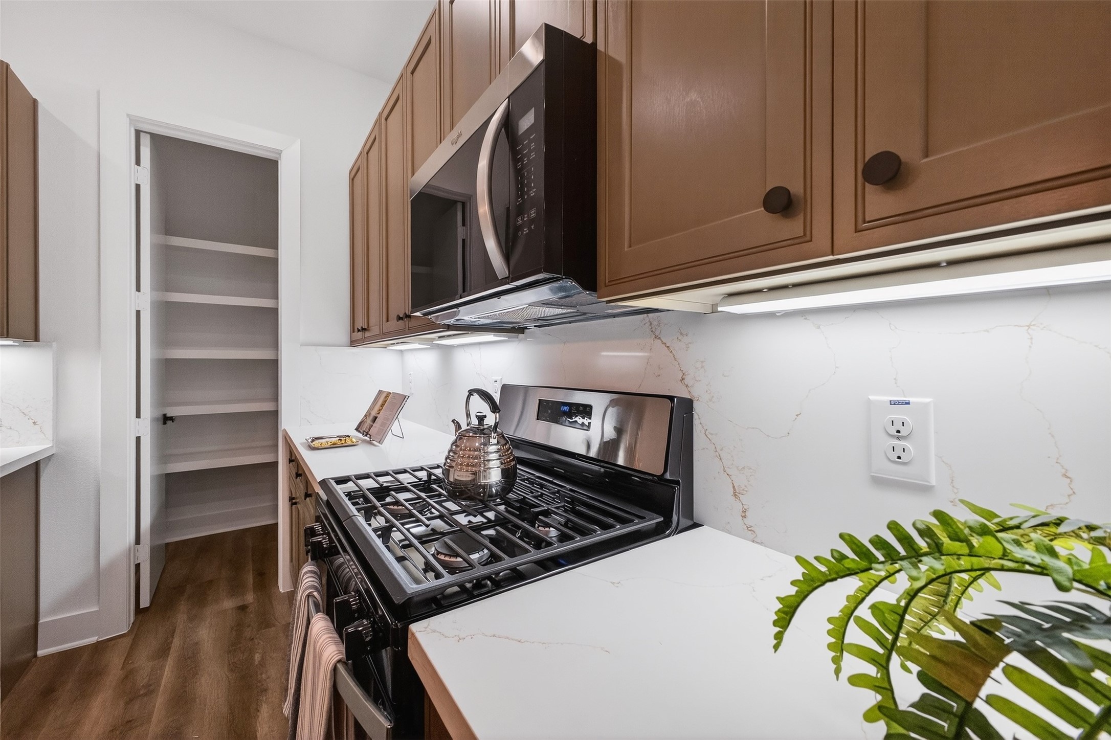 3003 A Delano Street Houston, TX 77004 - Photo 24 of 49 a stove top oven sitting inside of a kitchen