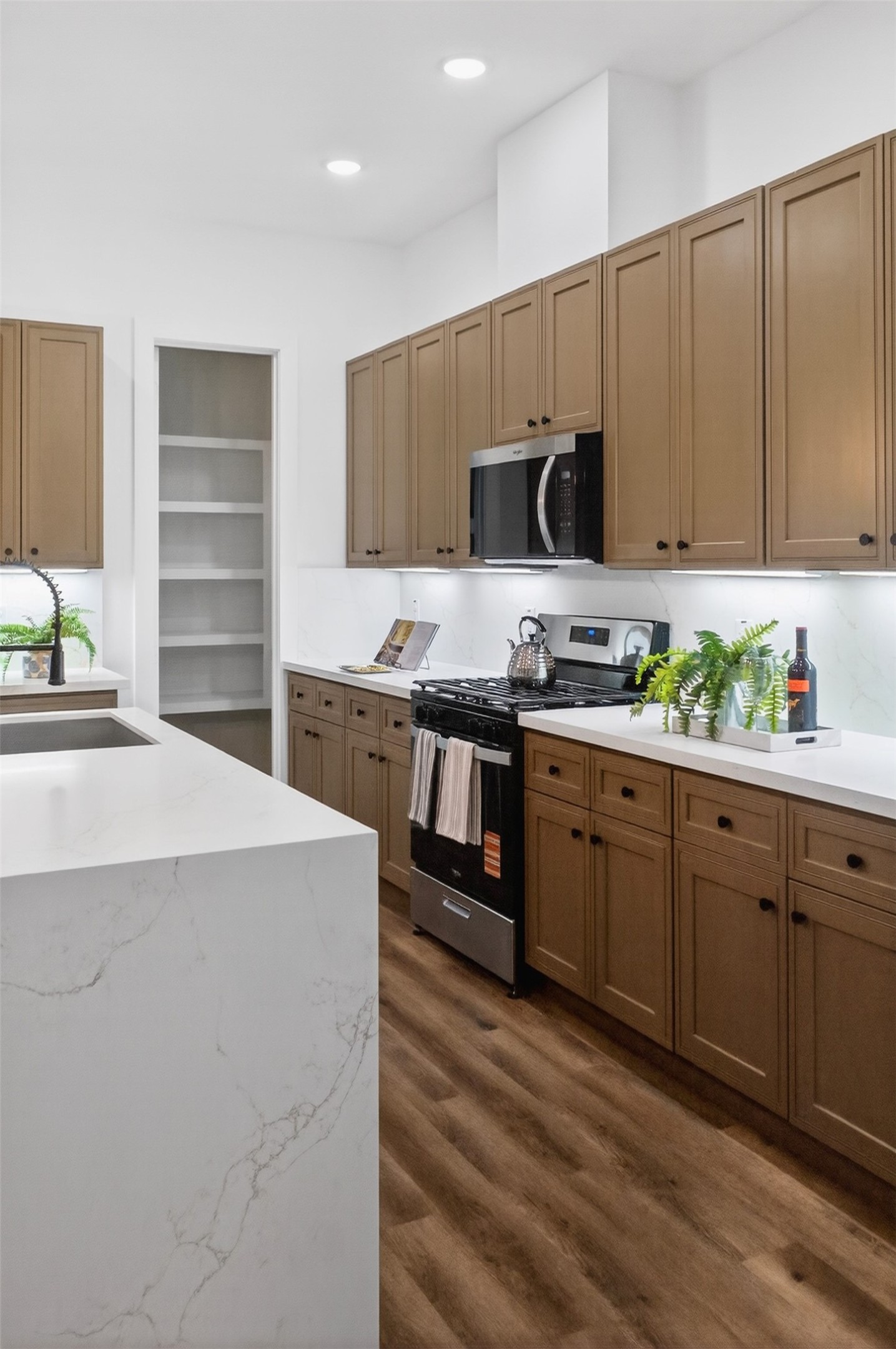 3003 A Delano Street Houston, TX 77004 - Photo 25 of 49 a kitchen with a sink a stove and cabinets