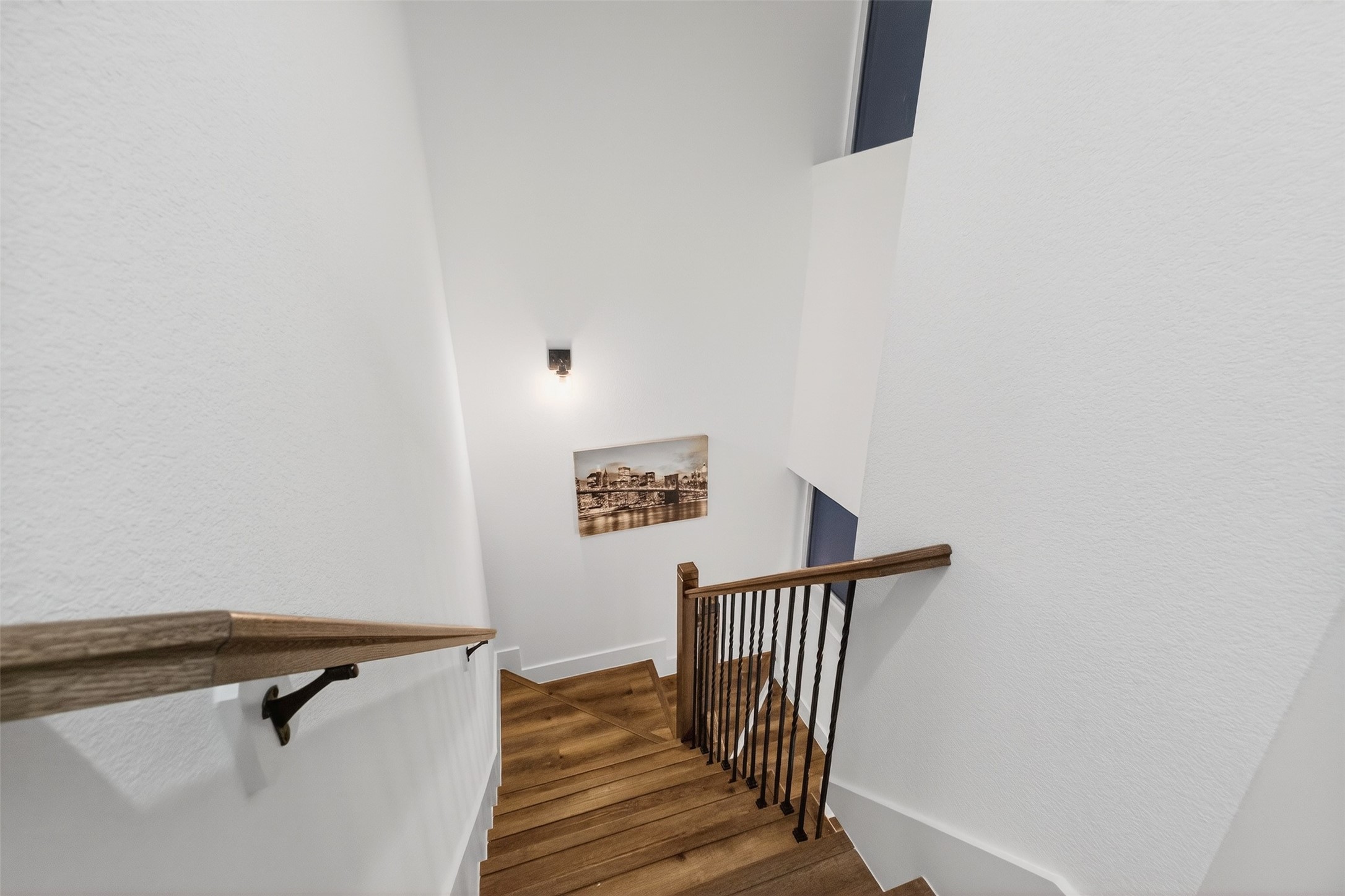 3003 A Delano Street Houston, TX 77004 - Photo 34 of 49 a view of a hallway with wooden floor and a potted plant