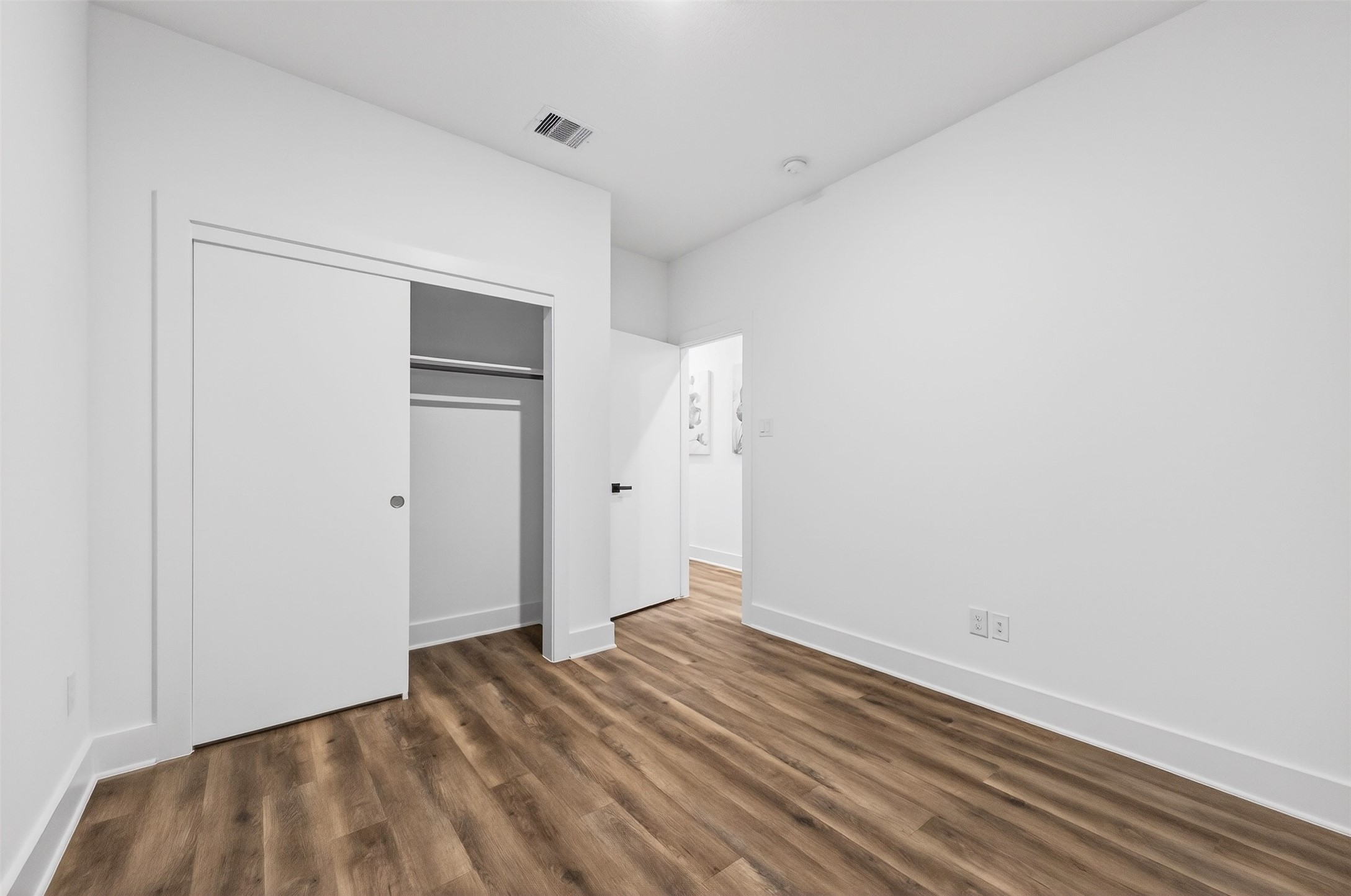 3003 A Delano Street Houston, TX 77004 - Photo 38 of 49 an empty room with wooden floor and closet