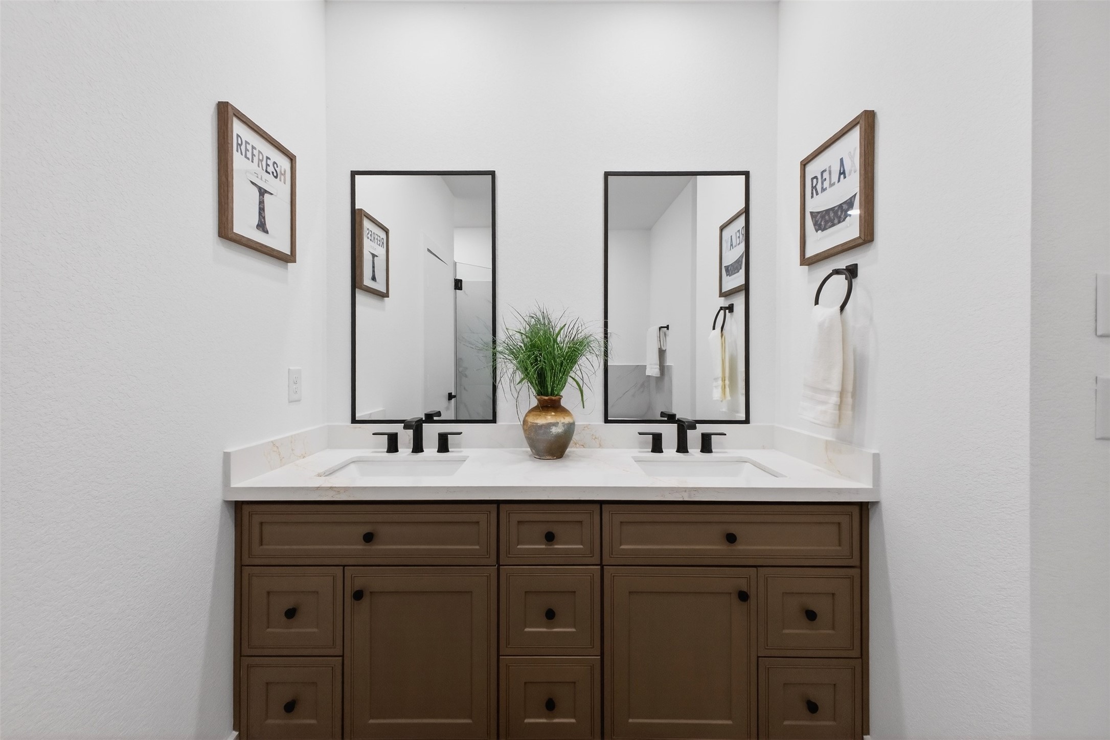 3003 A Delano Street Houston, TX 77004 - Photo 46 of 49 a bathroom with a double vanity sink and a mirror