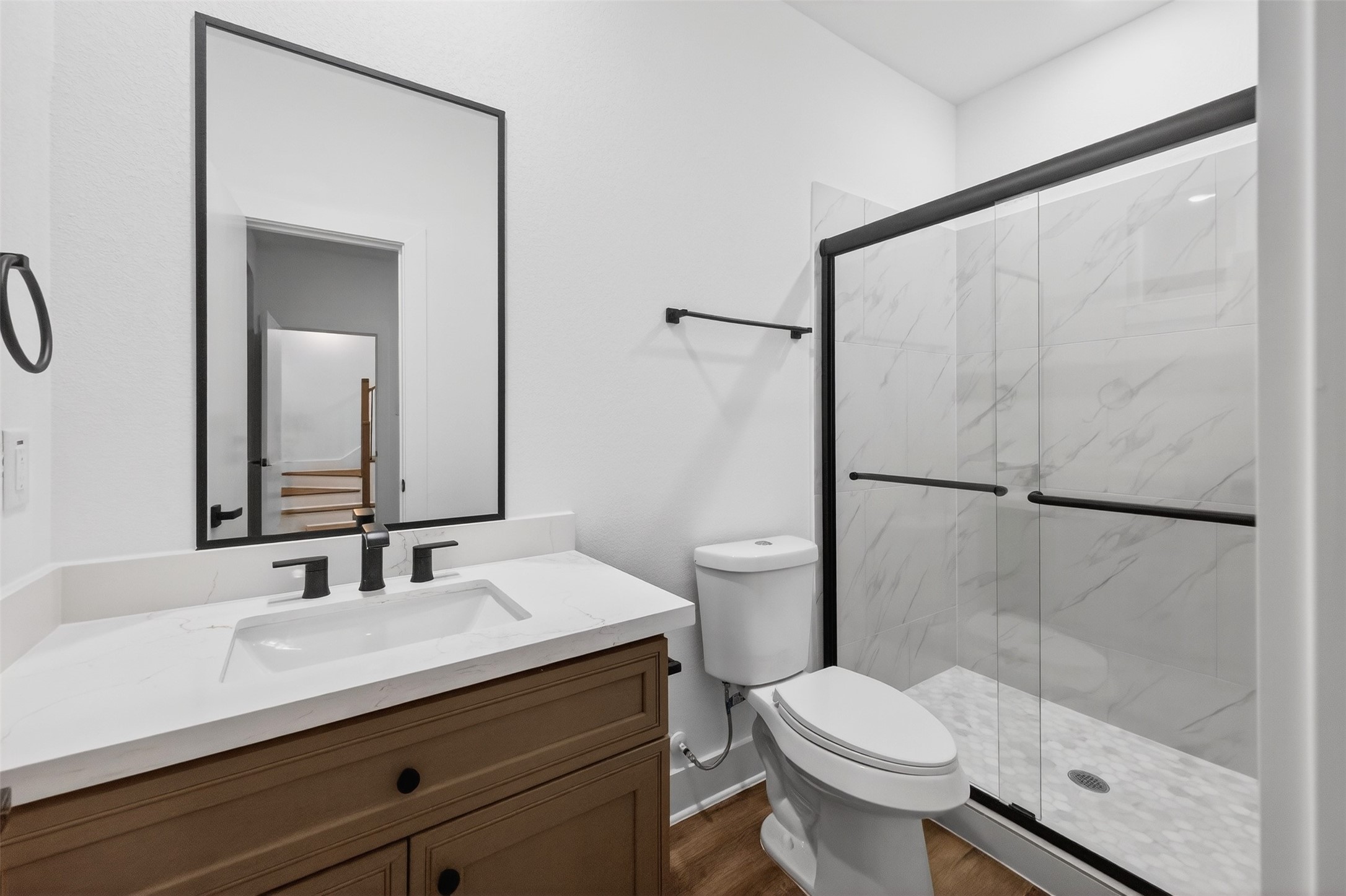 3003 A Delano Street Houston, TX 77004 - Photo 10 of 49 a bathroom with a sink a toilet a mirror and shower
