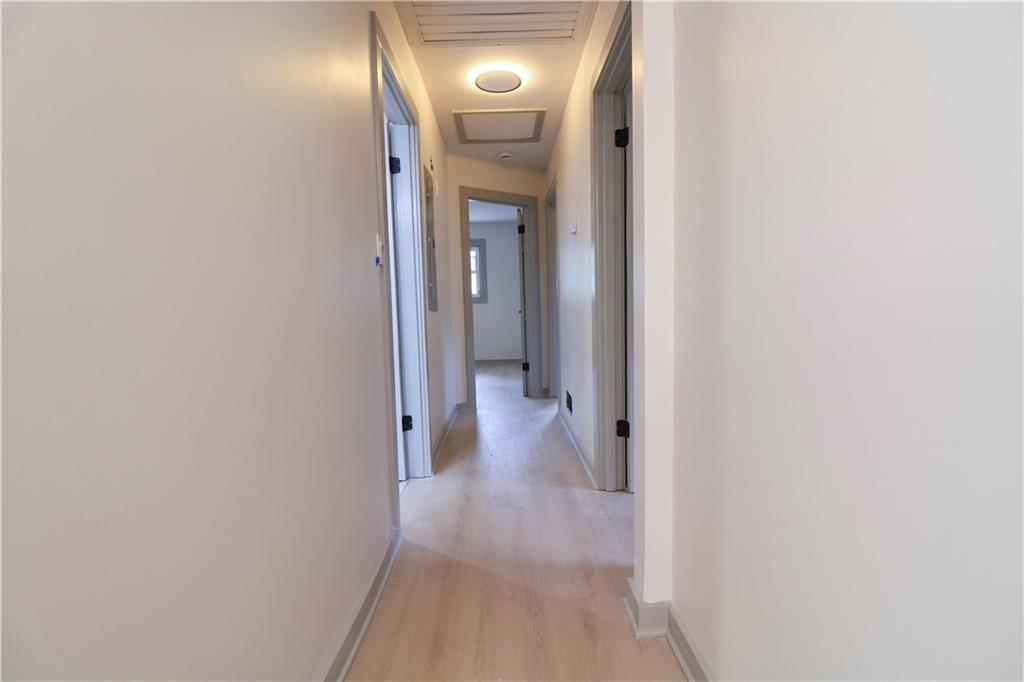 4396 Greenleaf Circle Southwest Atlanta, GA 30331 - Photo 8 of 18 a view of a hallway with wooden floor