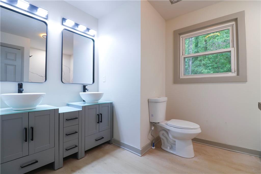 4396 Greenleaf Circle Southwest Atlanta, GA 30331 - Photo 9 of 18 a bathroom with a toilet sink and mirror