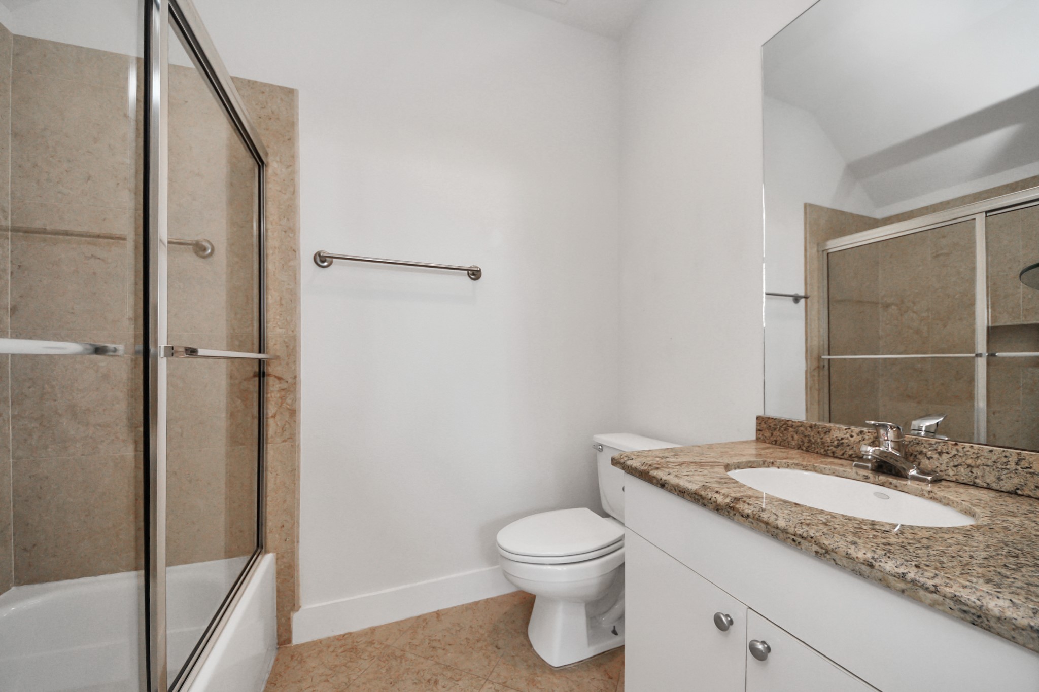 2436 Bissonnet Street, Unit 8 Houston, TX 77005 - Photo 11 of 42 a bathroom with a granite countertop sink toilet and shower