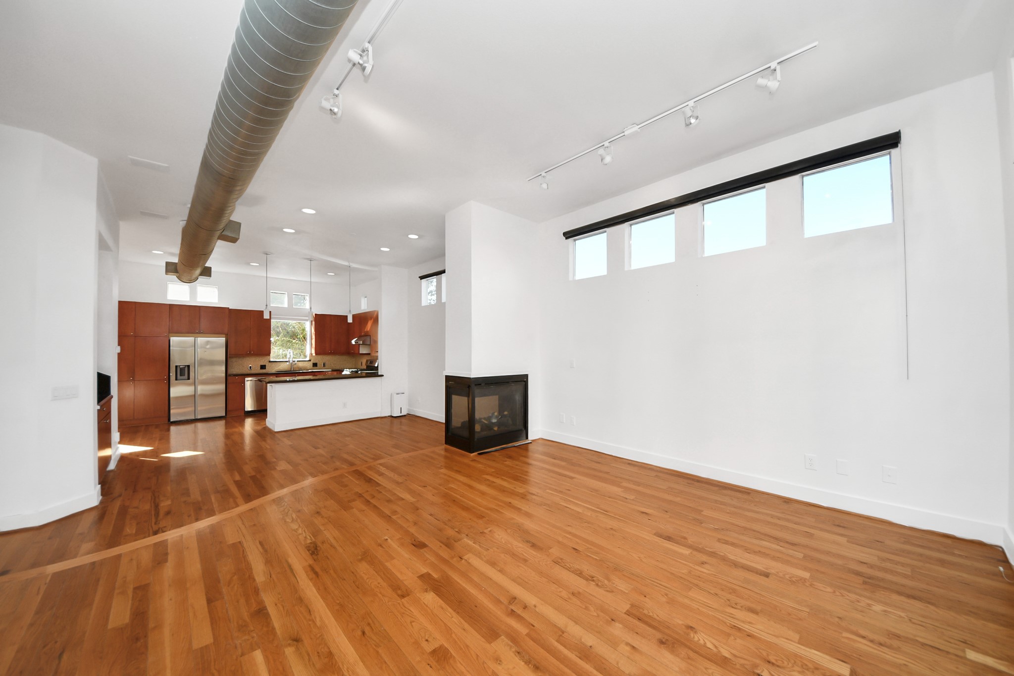 2436 Bissonnet Street, Unit 8 Houston, TX 77005 - Photo 13 of 42 a view of an empty room with a kitchen