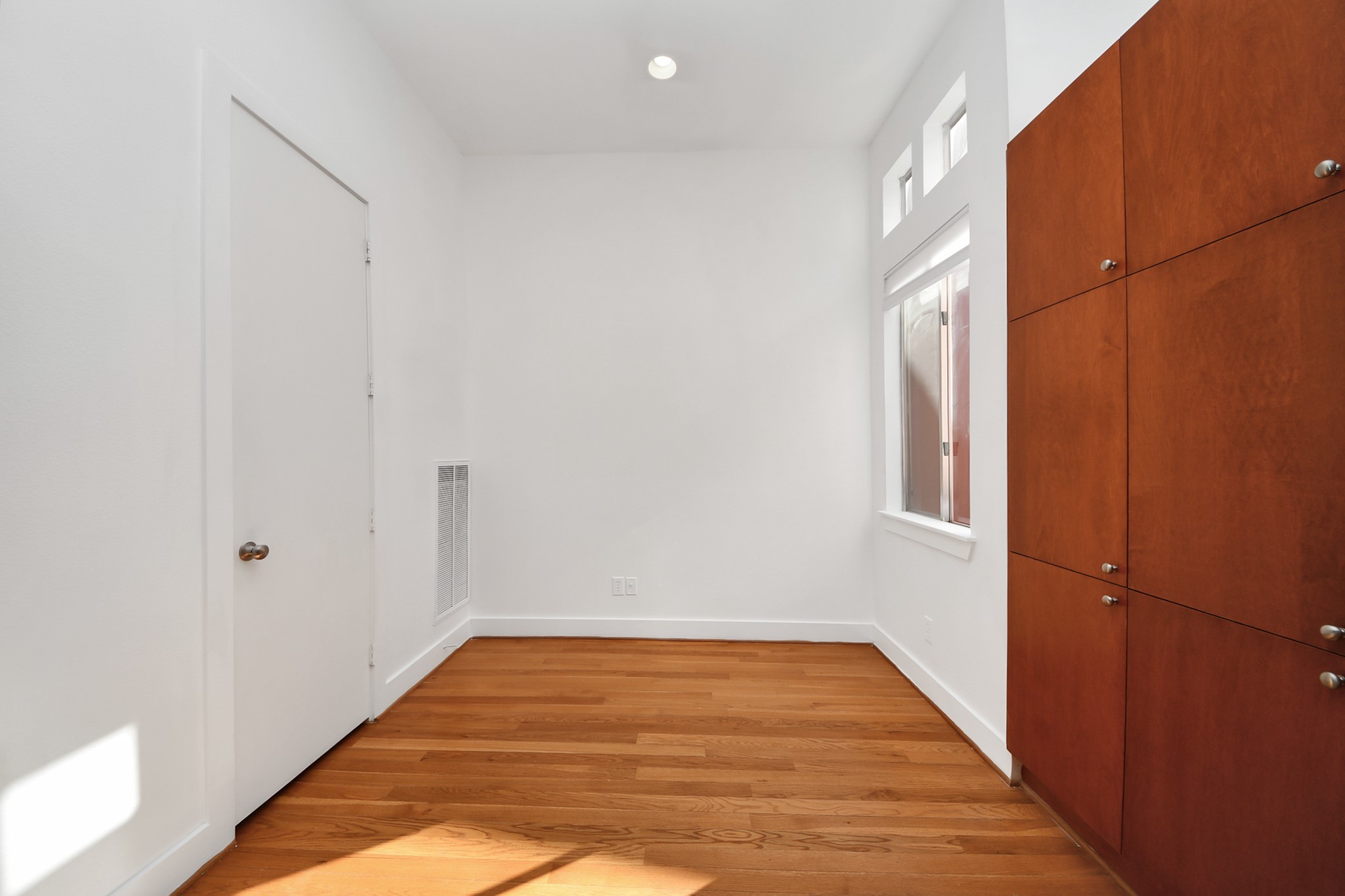 2436 Bissonnet Street, Unit 8 Houston, TX 77005 - Photo 19 of 42 a view of a room with wooden floor and a window