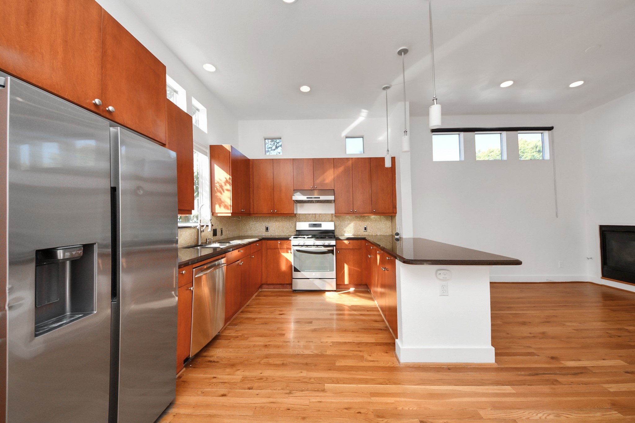 2436 Bissonnet Street, Unit 8 Houston, TX 77005 - Photo 21 of 42 a kitchen with stainless steel appliances granite countertop a refrigerator a sink and a stove