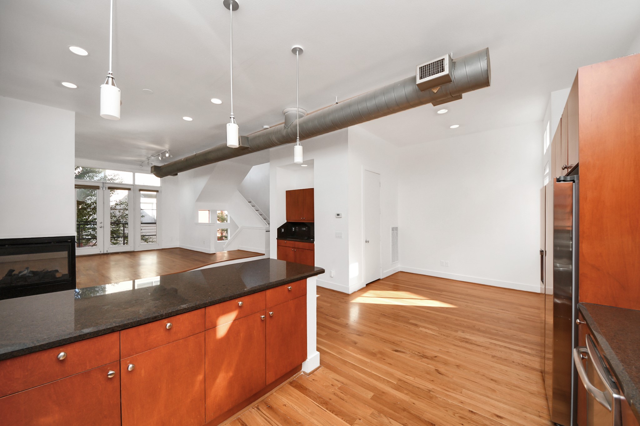 2436 Bissonnet Street, Unit 8 Houston, TX 77005 - Photo 25 of 42 a large kitchen with stainless steel appliances a large counter top