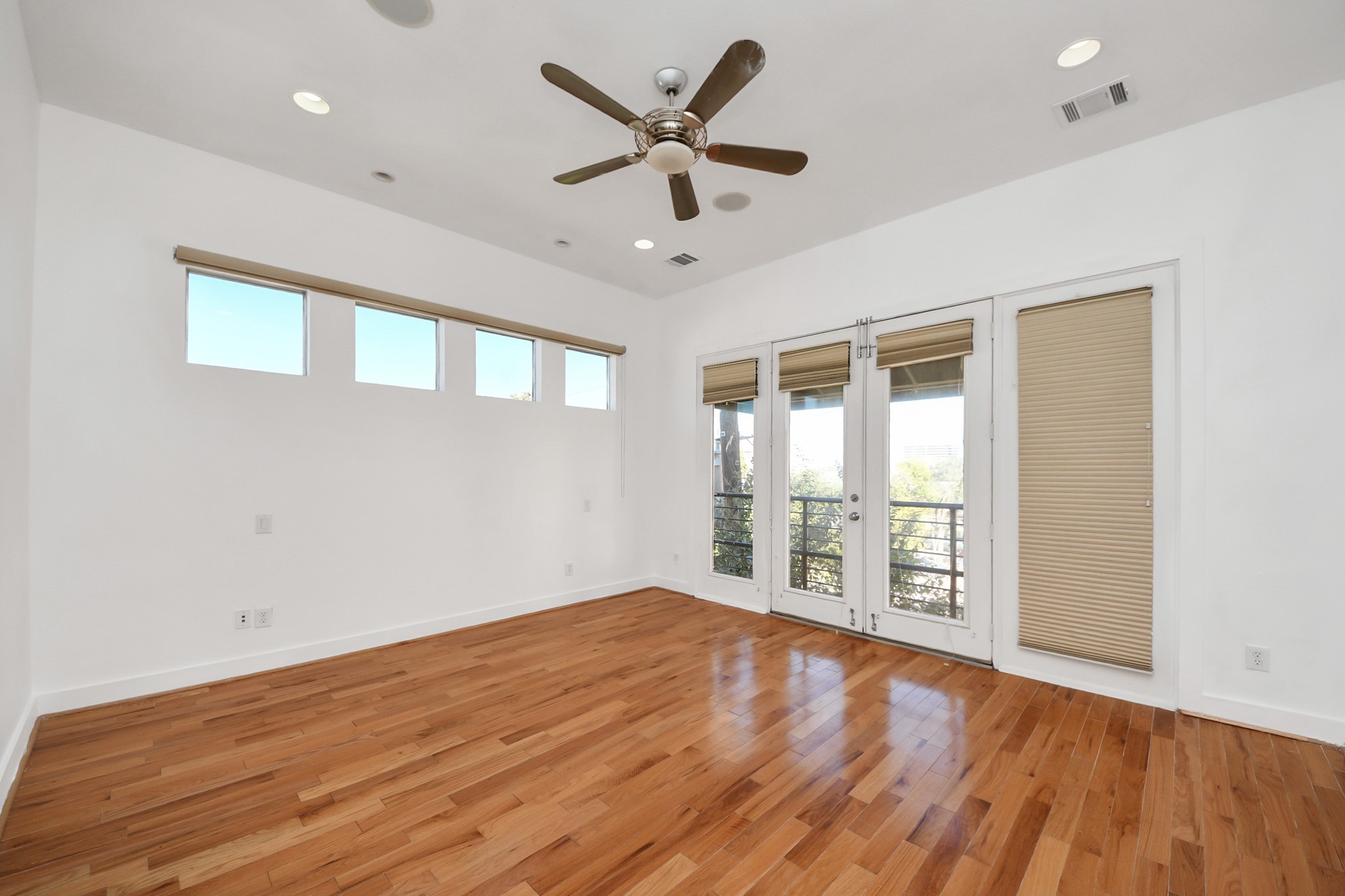 2436 Bissonnet Street, Unit 8 Houston, TX 77005 - Photo 27 of 42 wooden floor in an empty room with a window