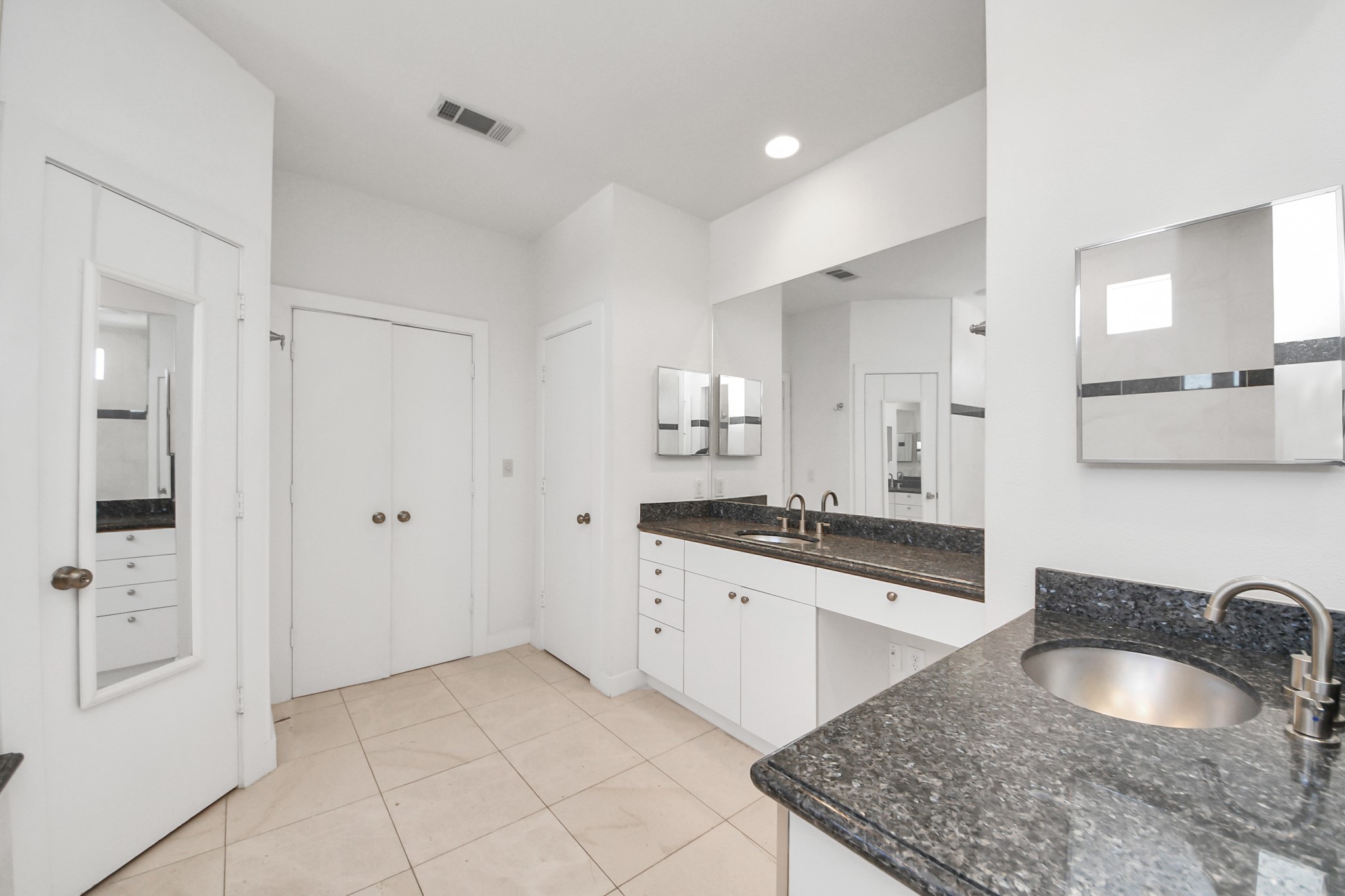 2436 Bissonnet Street, Unit 8 Houston, TX 77005 - Photo 31 of 42 a large bathroom with a granite countertop sink a mirror and shower