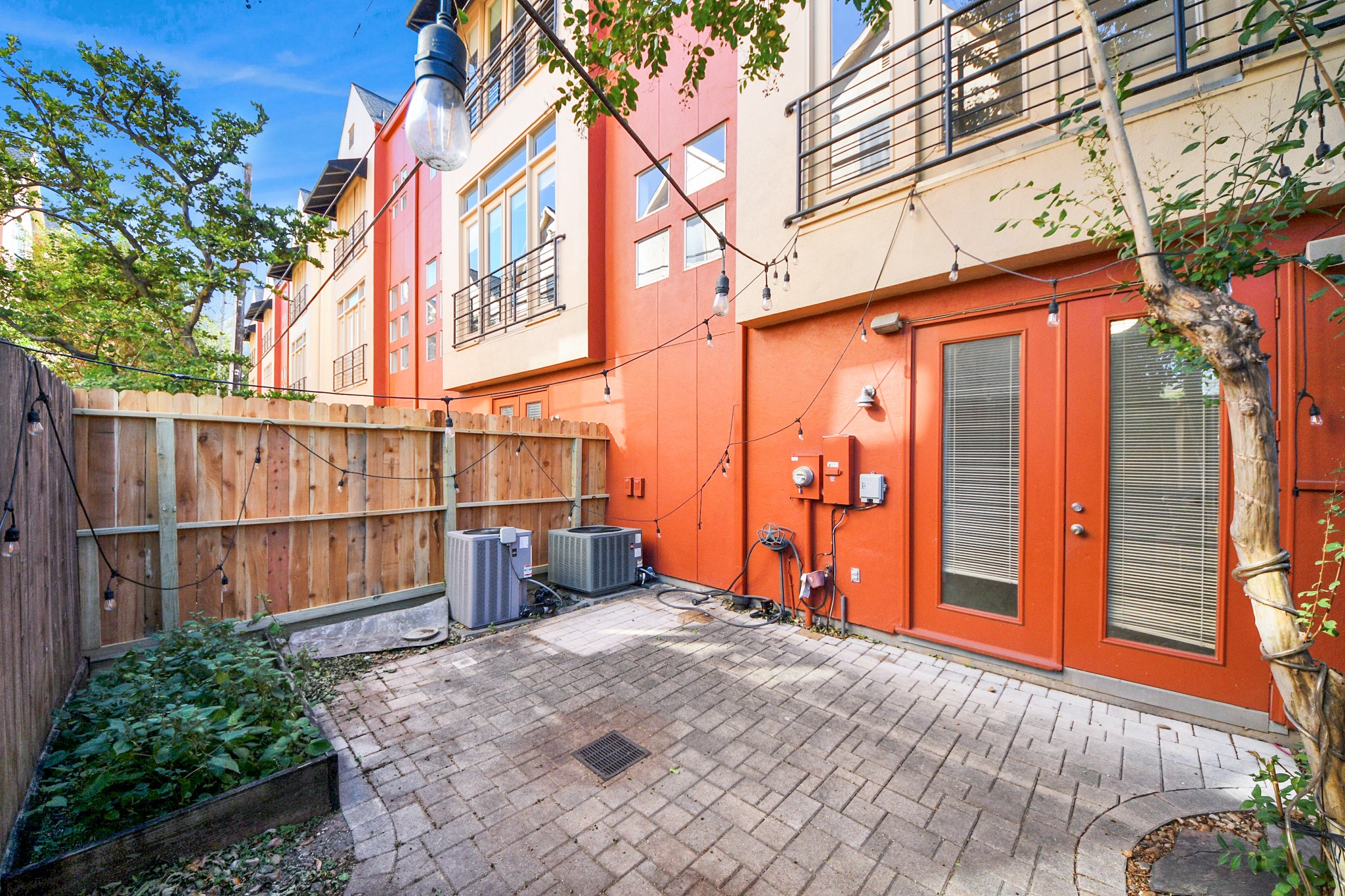 2436 Bissonnet Street, Unit 8 Houston, TX 77005 - Photo 41 of 42 a view of a street with wooden fence