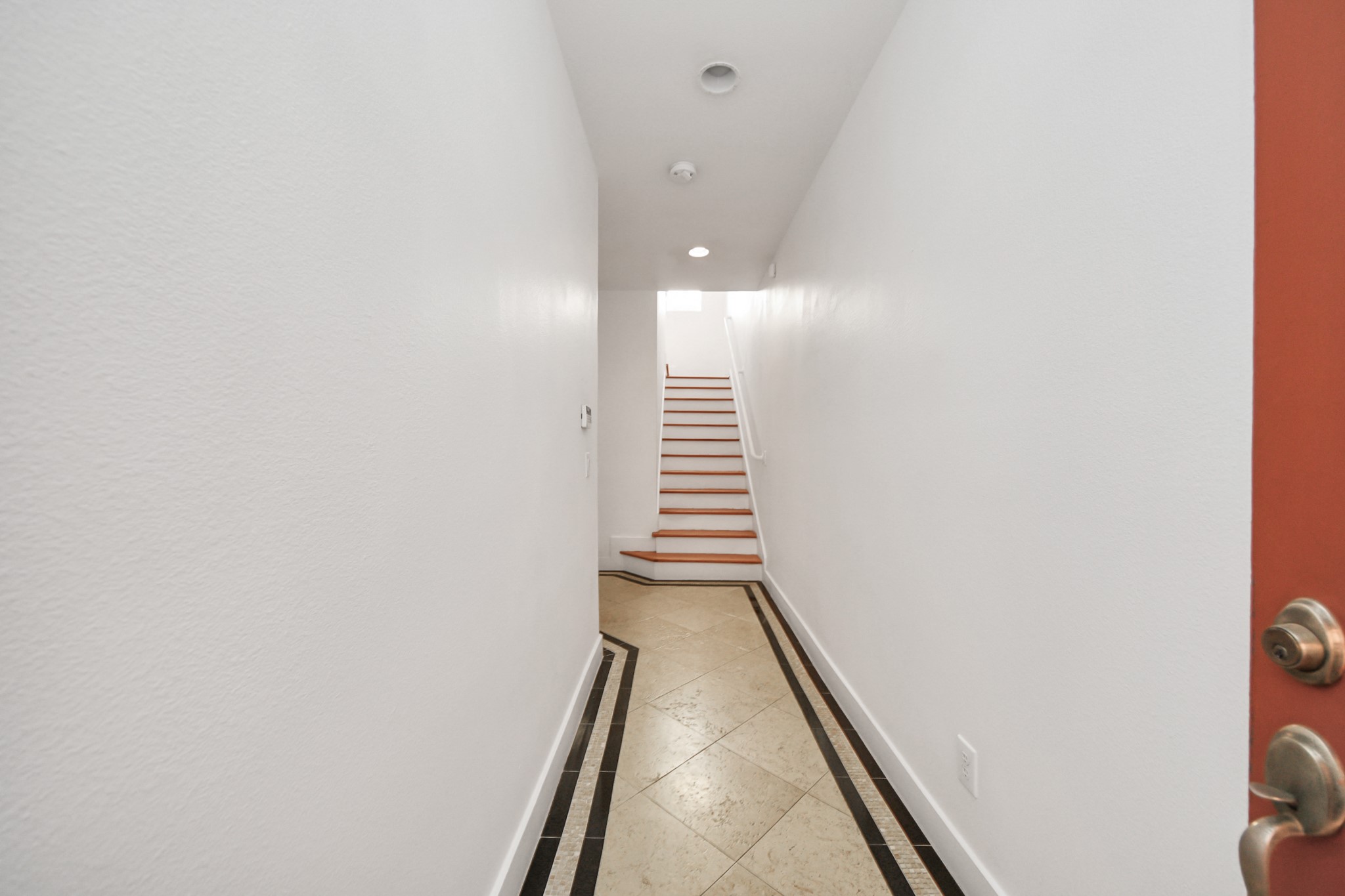 2436 Bissonnet Street, Unit 8 Houston, TX 77005 - Photo 7 of 42 a view of a hallway with stairs
