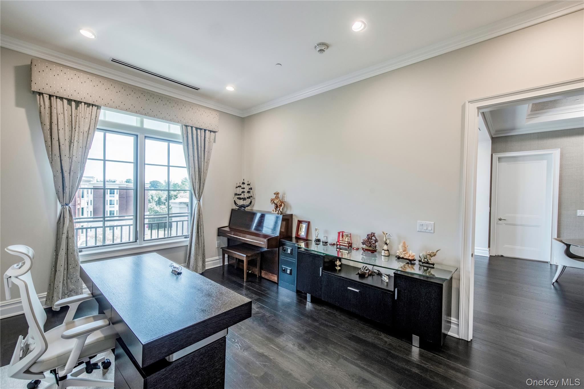 1000 Royal Court, Unit 1306 North Hills, NY 11040 - Photo 15 of 33 a room with furniture window and wooden floor