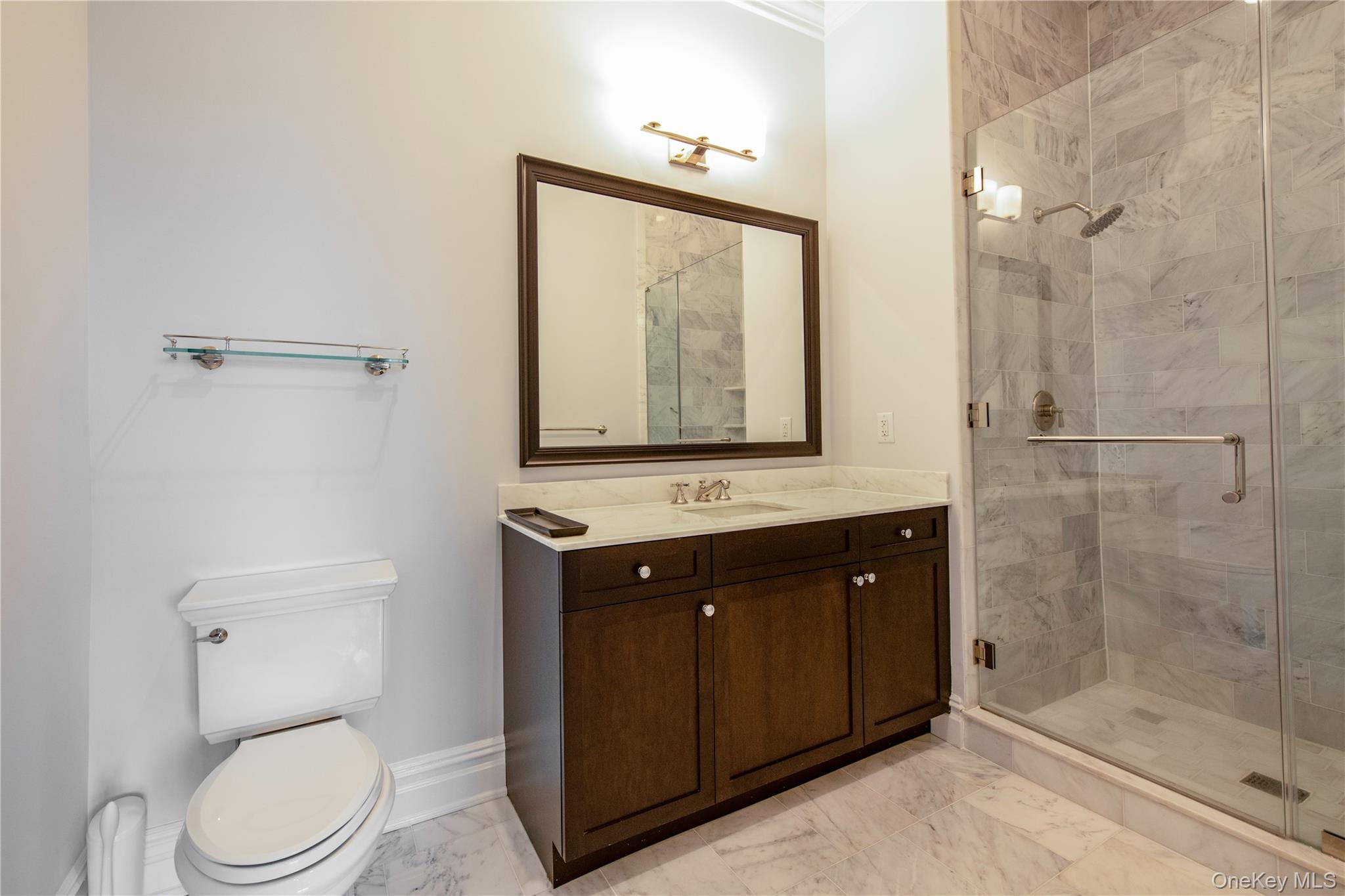 1000 Royal Court, Unit 1306 North Hills, NY 11040 - Photo 17 of 33 a bathroom with a toilet a sink and shower