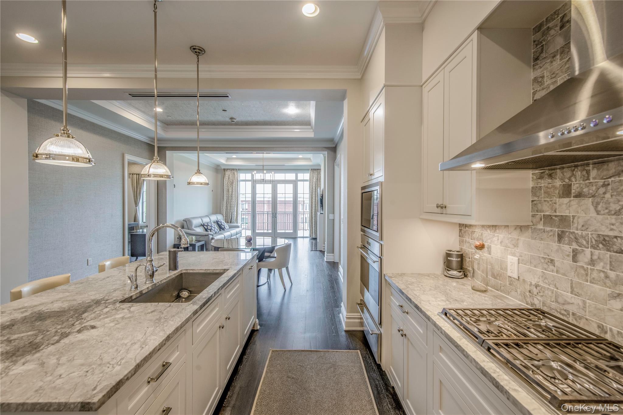 1000 Royal Court, Unit 1306 North Hills, NY 11040 - Photo 2 of 33 a large kitchen with a lot of counter space