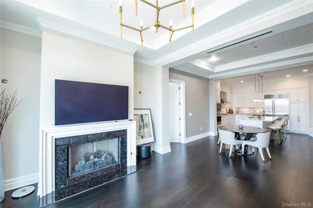 a living room with fireplace furniture and a flat screen tv