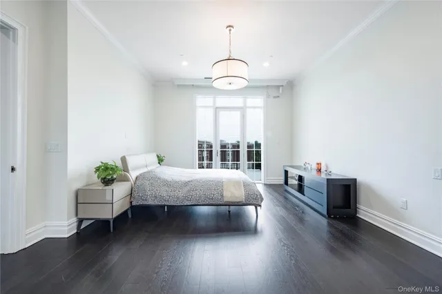 a living room with furniture a fireplace and wooden floor