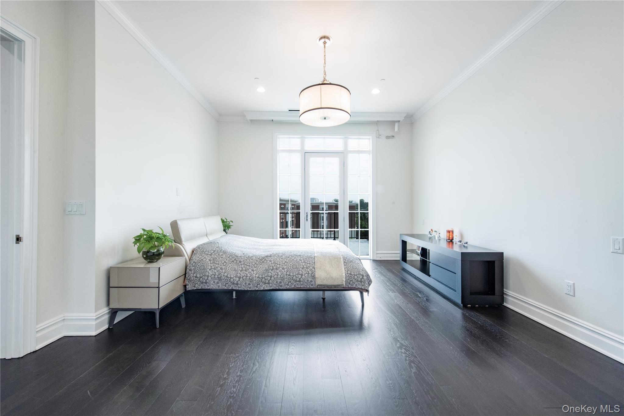 1000 Royal Court, Unit 1306 North Hills, NY 11040 - Photo 8 of 33 a living room with furniture and a window