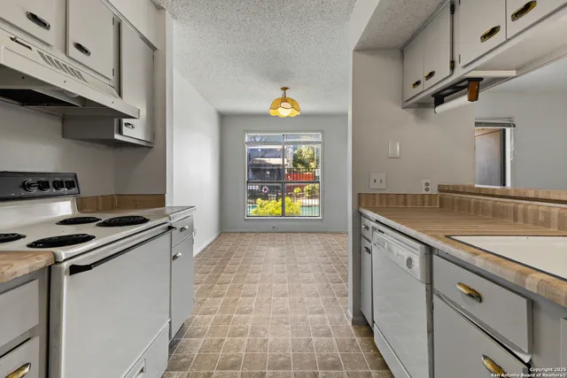 a view of a small house with red door