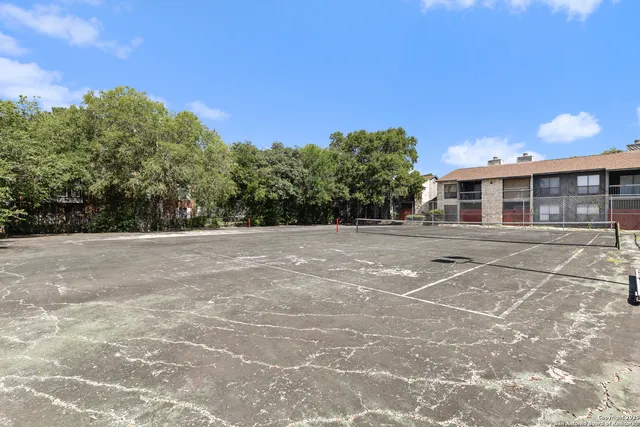 front view of a house with a tree