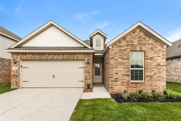 a front view of a house with garage