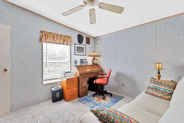 a workspace with furniture and a window