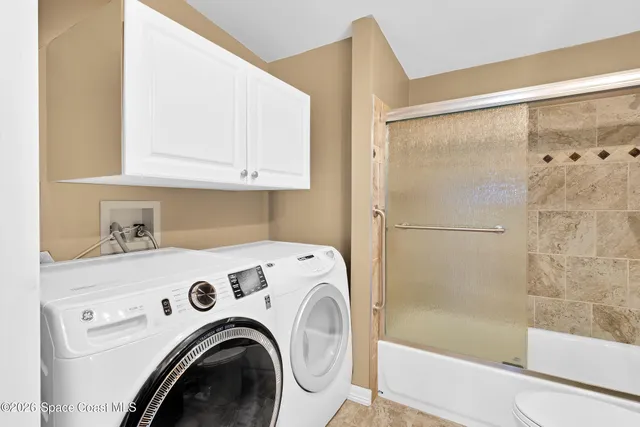 a utility room with dryer and washer