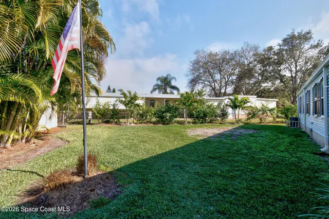 a view of a garden in the backyard