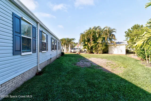 a view of house with yard