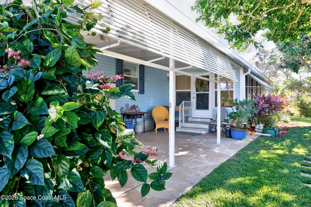 a front view of a house with patio