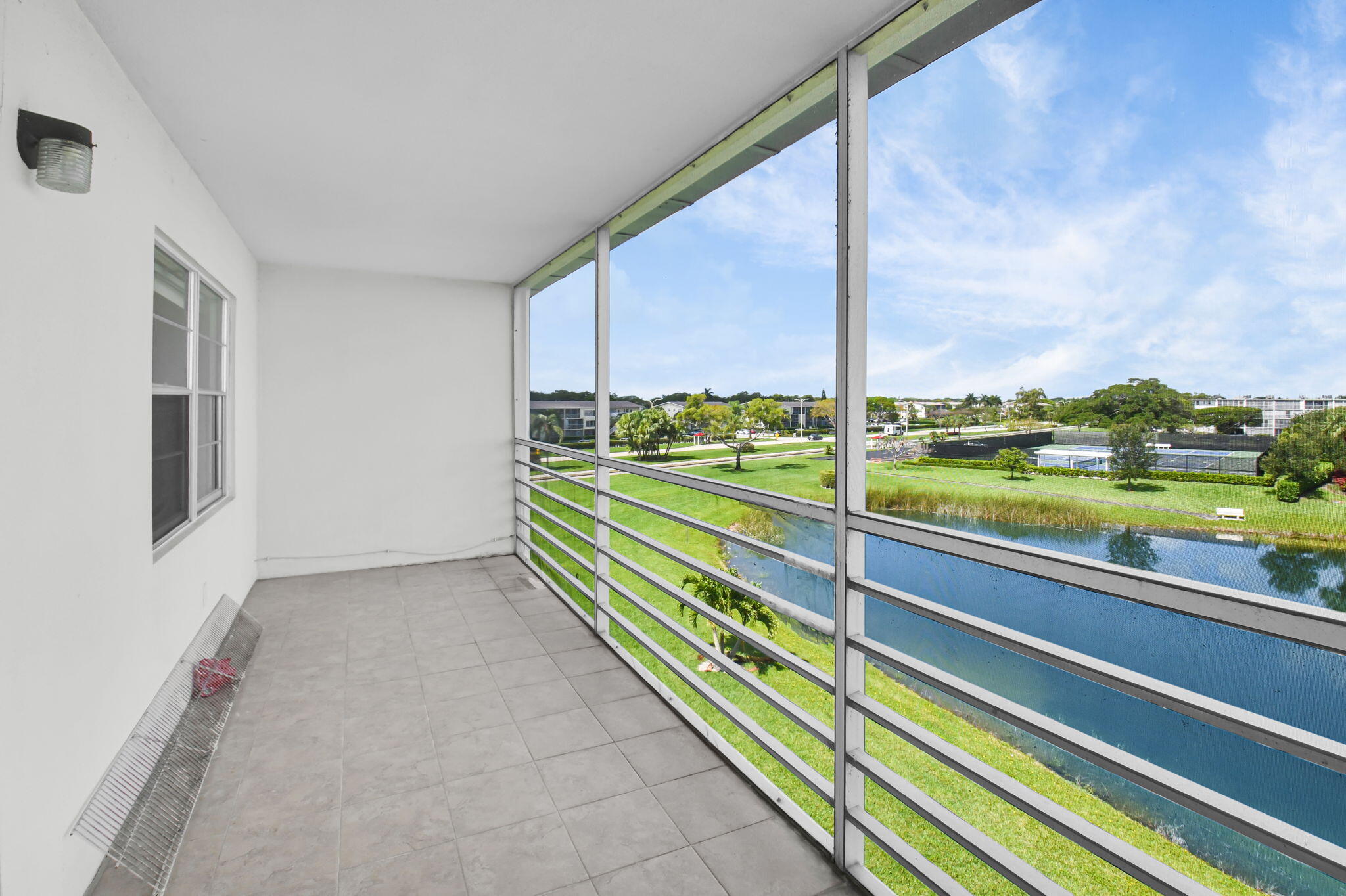 4088 Exeter Boca Raton, FL 33434 - Photo 24 of 48 Screened Patio w/Lake View