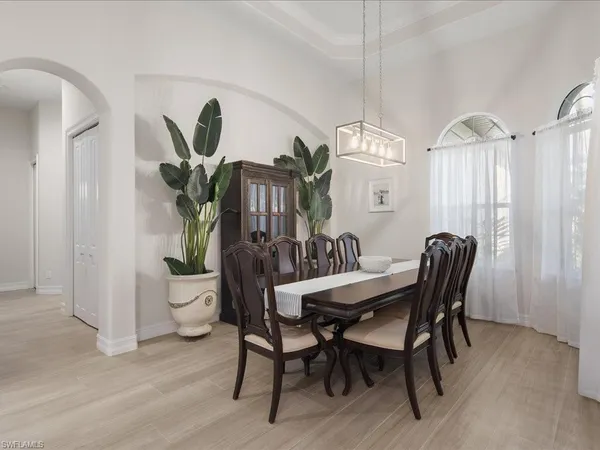 a view of a dining room with furniture window and outside view
