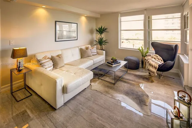 a living room with furniture and a window