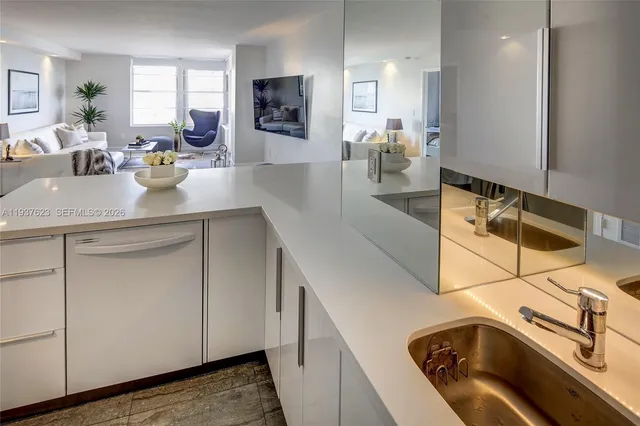 a kitchen with a sink cabinets and appliances