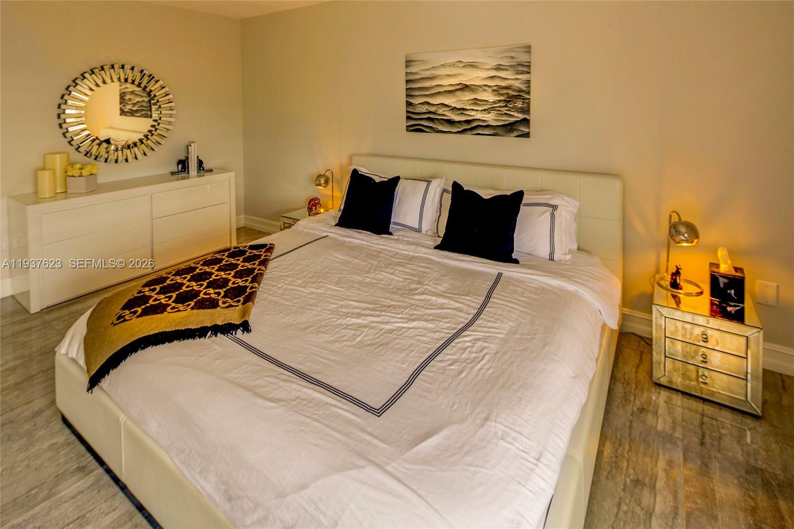 2899 Collins Avenue, Unit 617 Miami Beach, FL 33140 - Photo 4 of 4 a bedroom with a bed and wooden floor