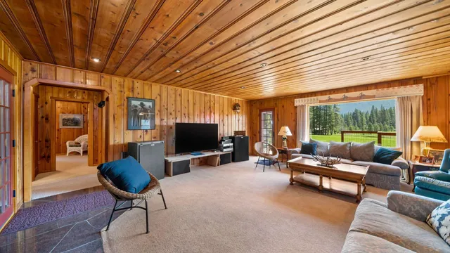 a spacious bedroom with a bed and a window