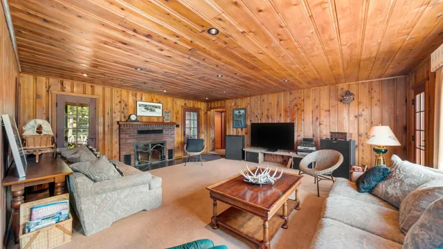 a bathroom with a sink a toilet a mirror and shower