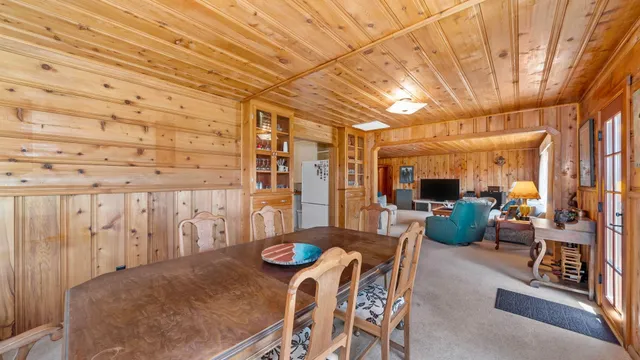 a bedroom with a bed and chair