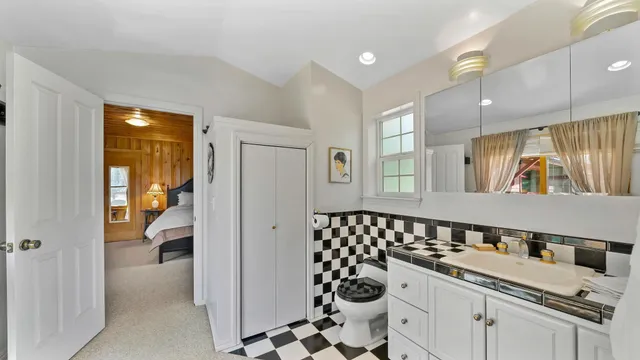 a view of a house with a yard and sitting area