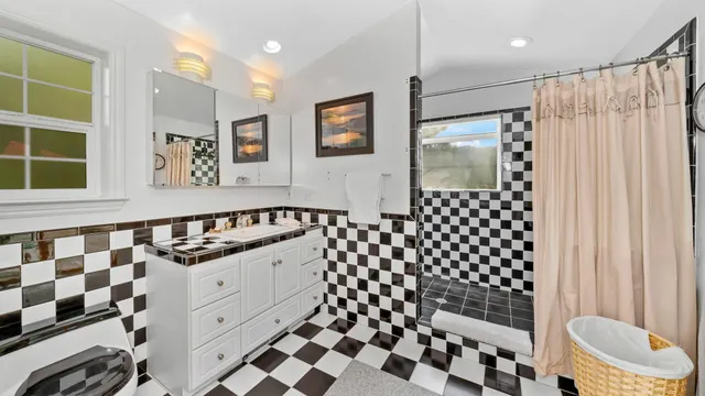 a view of a backyard with wooden fence