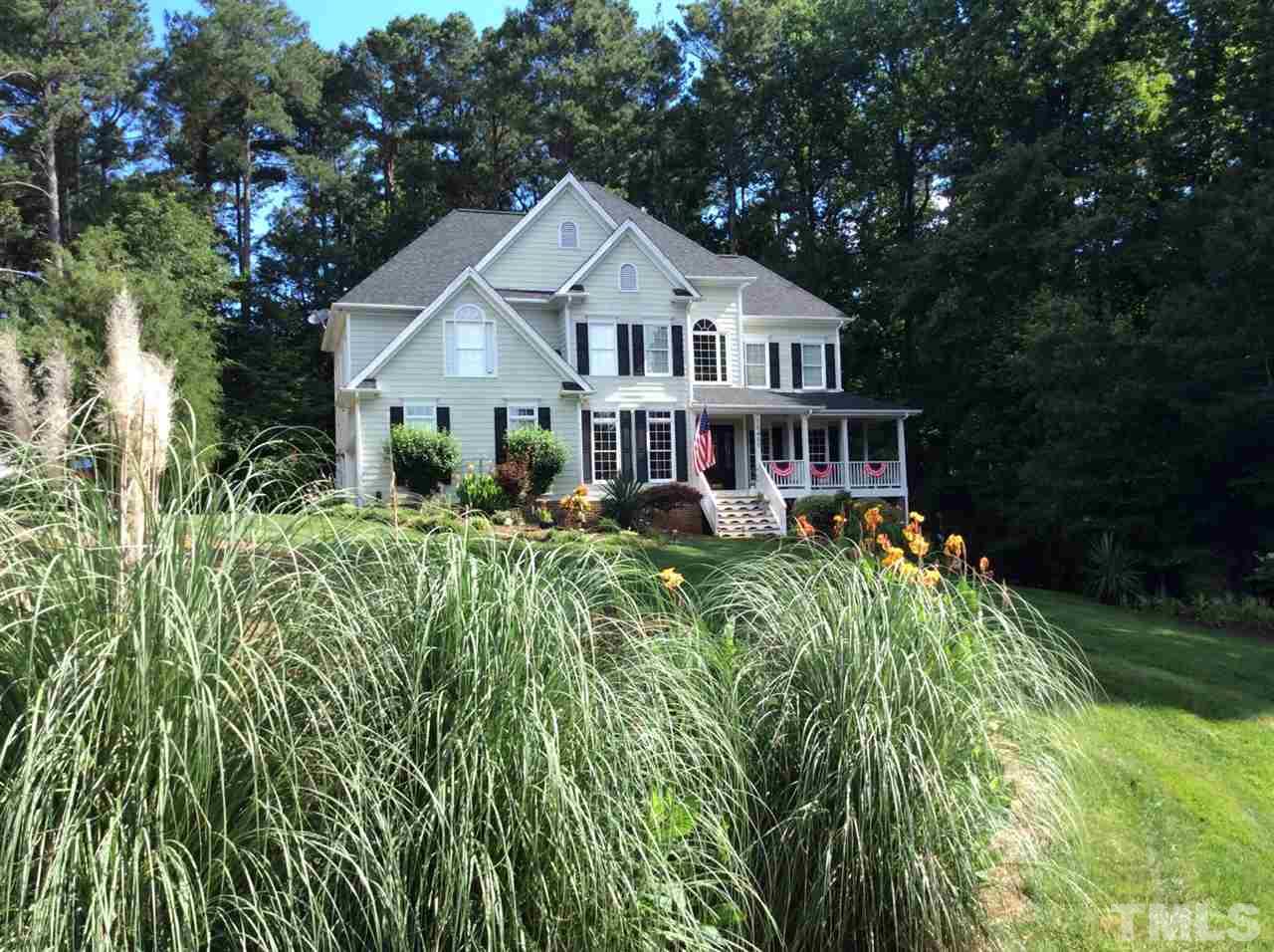 10400 Old Warden Road Raleigh, NC 27615 - Photo 1 of 30 a front view of a house with a yard