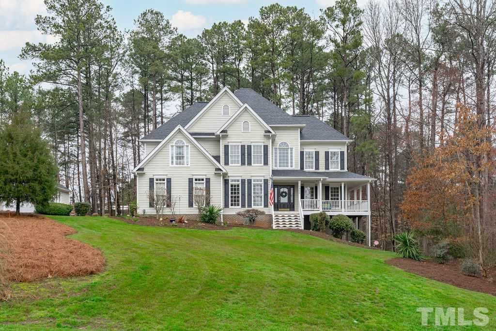 10400 Old Warden Road Raleigh, NC 27615 - Photo 2 of 30 a front view of a house with a yard table and chairs