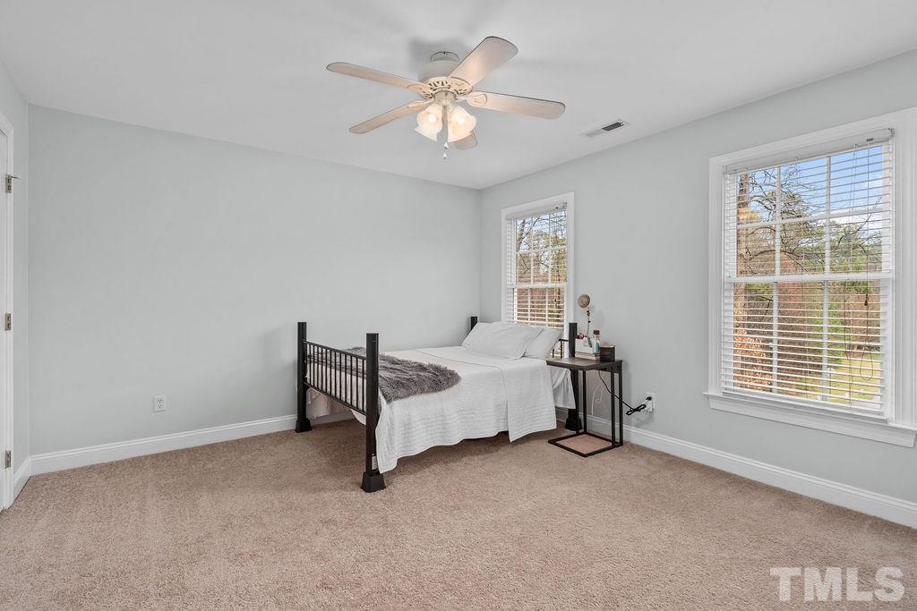 10400 Old Warden Road Raleigh, NC 27615 - Photo 14 of 30 a bed room with a bed and a window