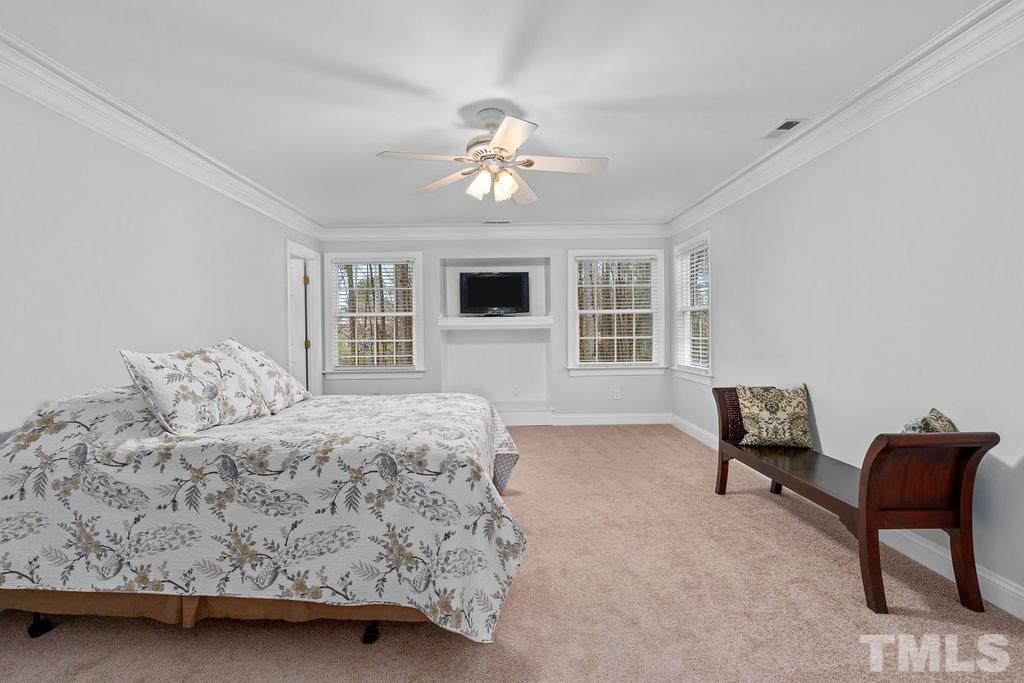10400 Old Warden Road Raleigh, NC 27615 - Photo 15 of 30 a bedroom with a bed and a couch