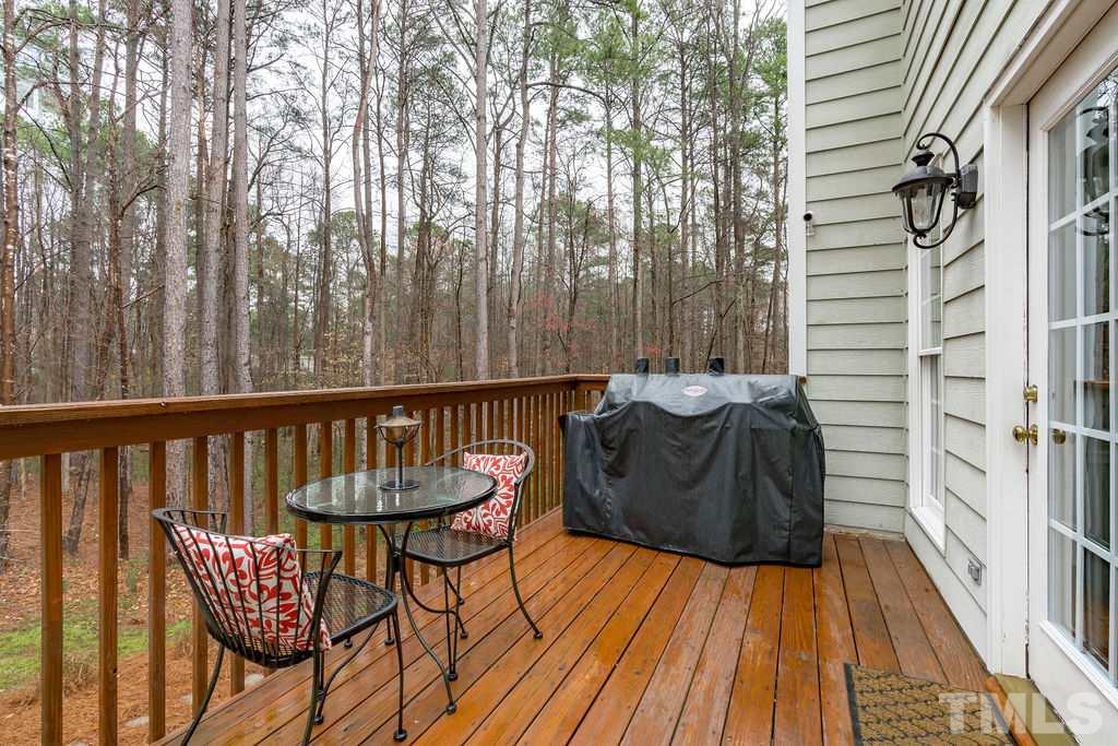 10400 Old Warden Road Raleigh, NC 27615 - Photo 29 of 30 a view of balcony with wooden floor and outdoor seating
