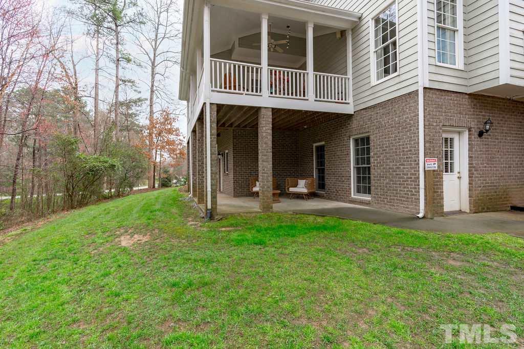 10400 Old Warden Road Raleigh, NC 27615 - Photo 30 of 30 a view of a house with backyard porch and sitting area